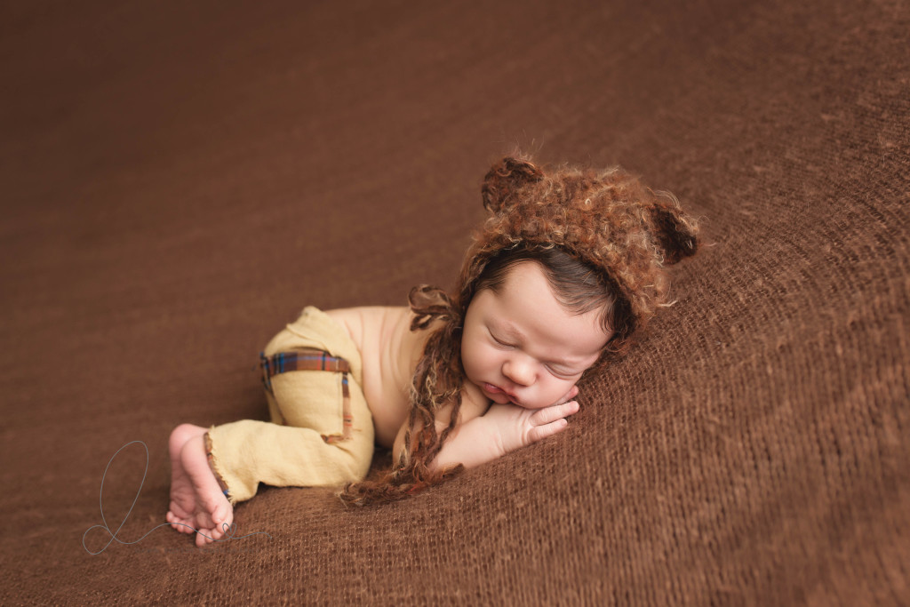 newborn baby boy side lying pose