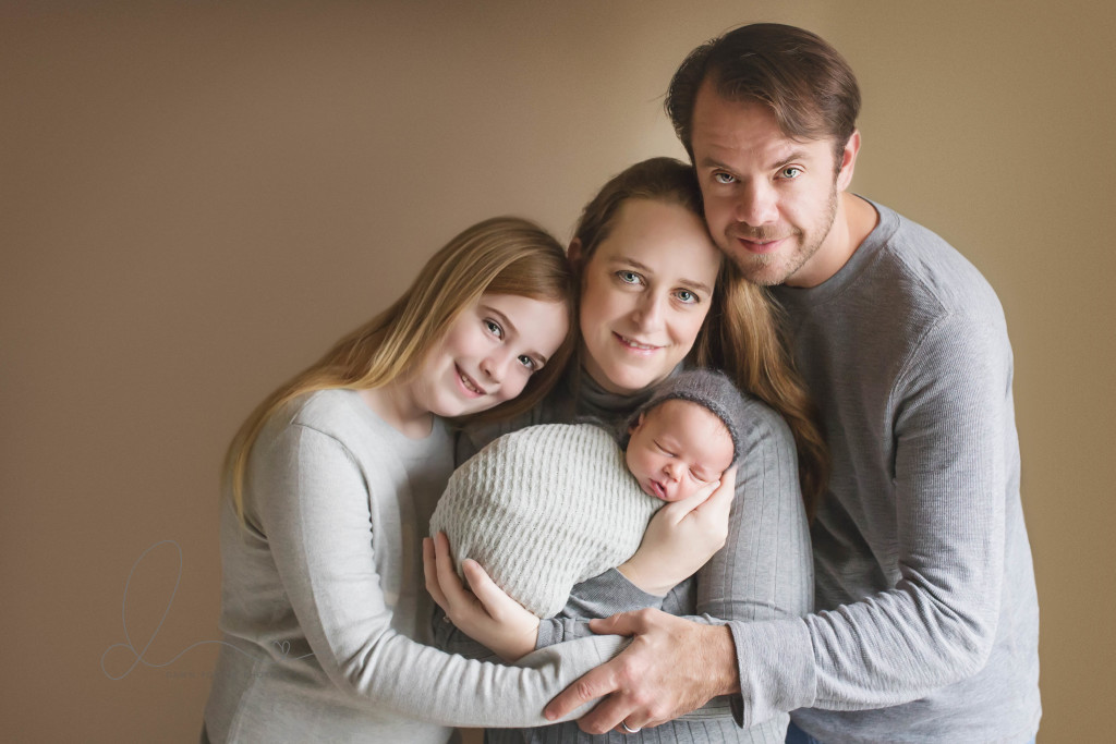 newborn baby boy wrapped with family | issaquah baby photographer
