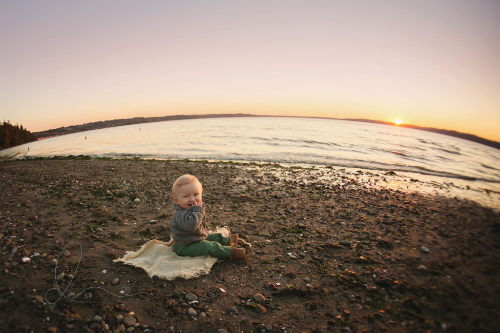 baby boy on the beach with fisheye lens