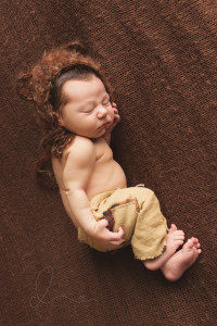 newborn baby boy side lying pose