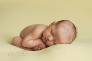 womb pose | baby girl on yellow | Seattle newborn photography